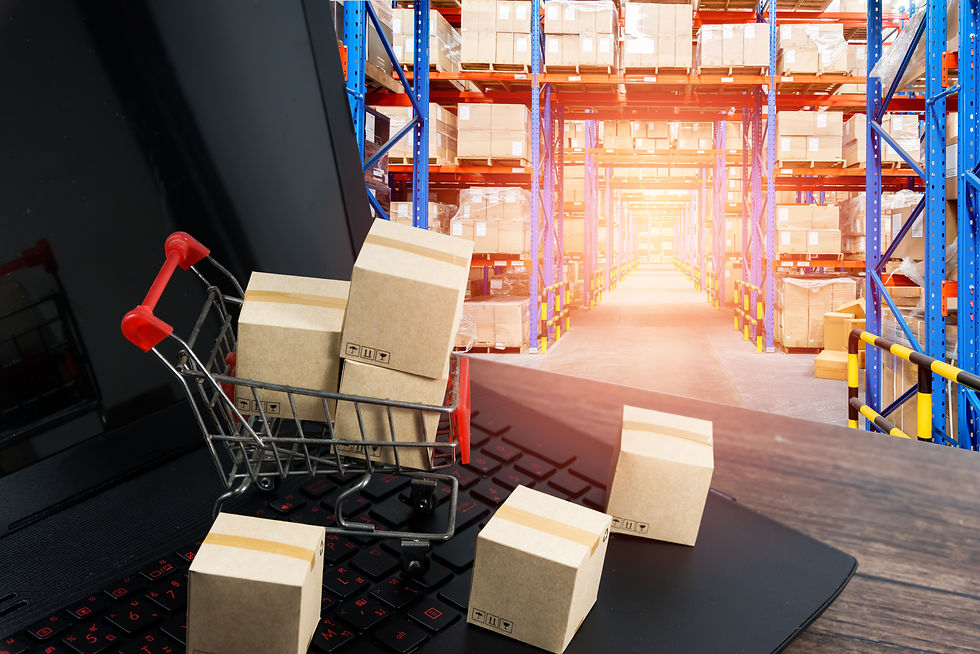 Mini shopping cart with boxes on a laptop keyboard, overlaid on a warehouse aisle of stacked cartons and bright blue racks.