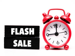 Red alarm clock at 10:10 next to black blocks with white "FLASH SALE" text on a white background, creates urgency.