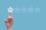 Hand taps a sad white star rating icon on a blue background, with five stars showing moods from sad to happy