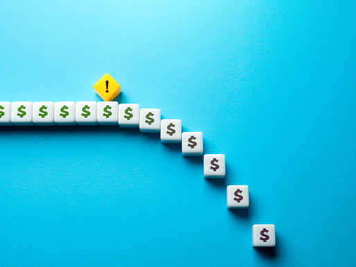 Dice with dollar signs form a descending curve on a blue background, ending with a yellow die with an exclamation mark, symbolizing caution.