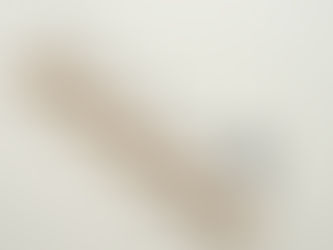 Wooden stairs with a dashed line bouncing down to a percentage symbol on a light beige background, suggesting financial concepts.