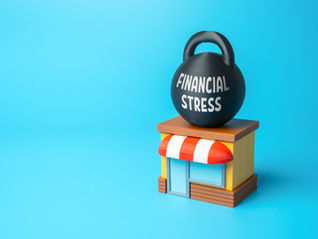 Small shop with a red and white awning under a black weight labeled "Financial Stress," set against a bright blue background.