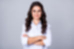 Confident woman on a gray background.