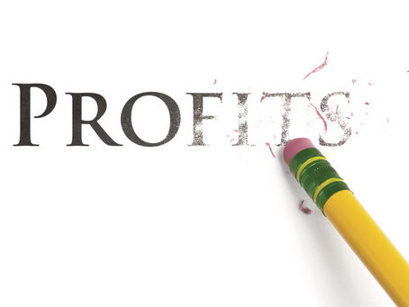 Close up of a yellow pencil erasing the word, 'Profits'. Isolated on white.