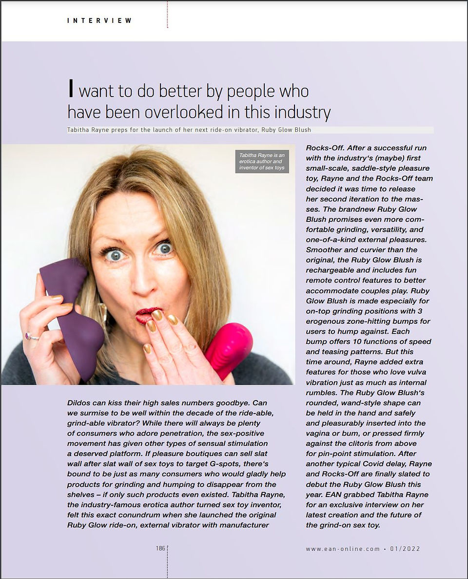 Mag article for EAN Online - pic of me, Tabitha Rayne -white woman slightly ginger hair- holding 2 Ruby Glow sex toys and surrounding text - click link for website e-mag - tagline- "I want to do better by people who have been overlooked in this industry" ie those of us who like ride on sex toys