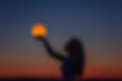 a-young-woman-holds-the-full-moon-in-her-hands-aga-2022-08-01-05-06-25-utc-min.jpg