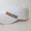 Miniatura: GORRA BLANCA-CAQUI