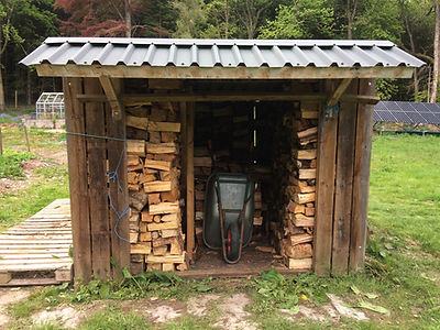log shed and wheelbarrow