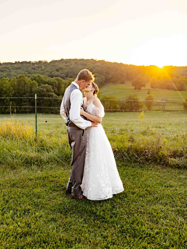 Wedding couple at sunset kissing in the Columbia, MO area.