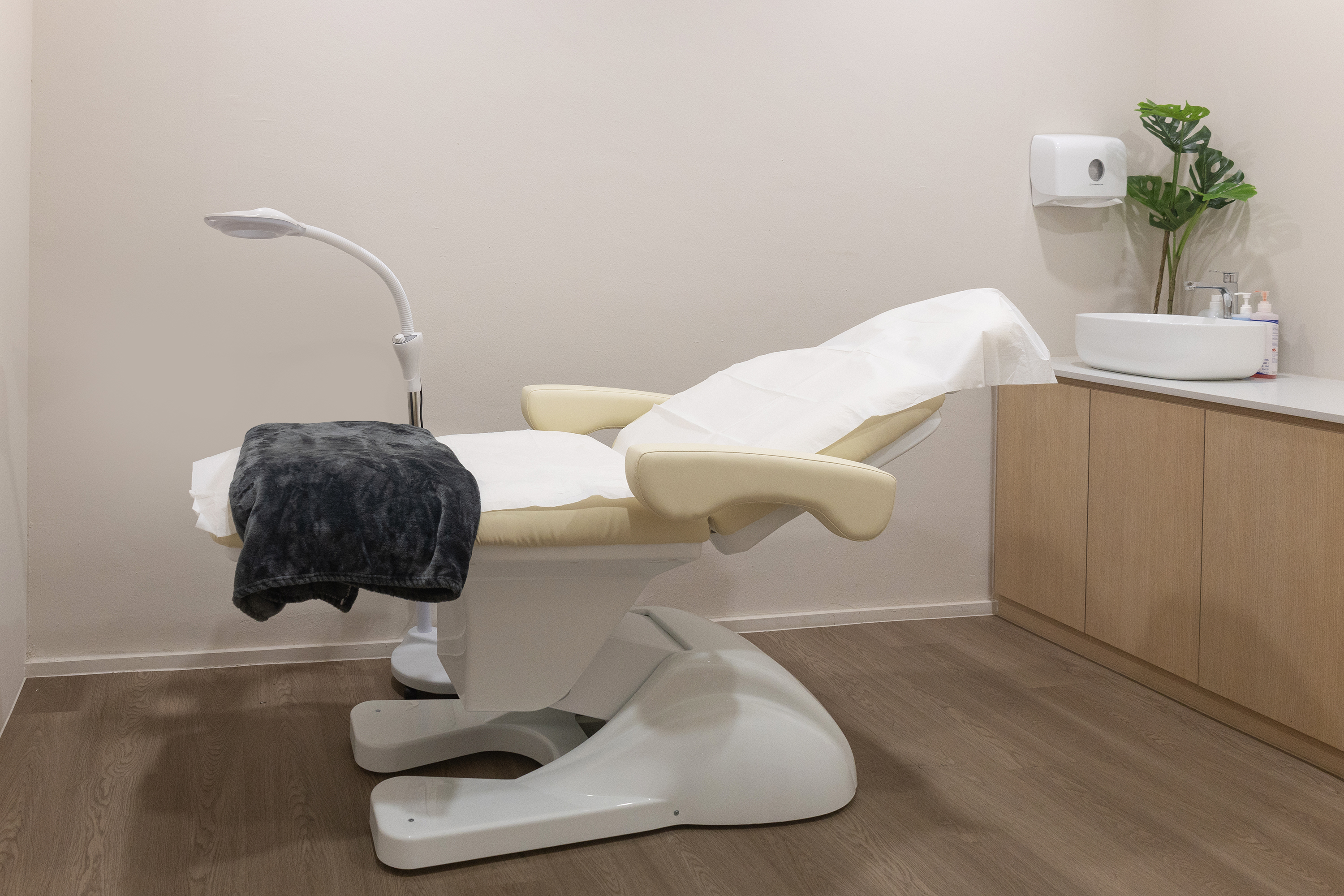 Treatment room at The Acne Clinic in i12 Katong Singapore with a patient chair and clean modern setup.