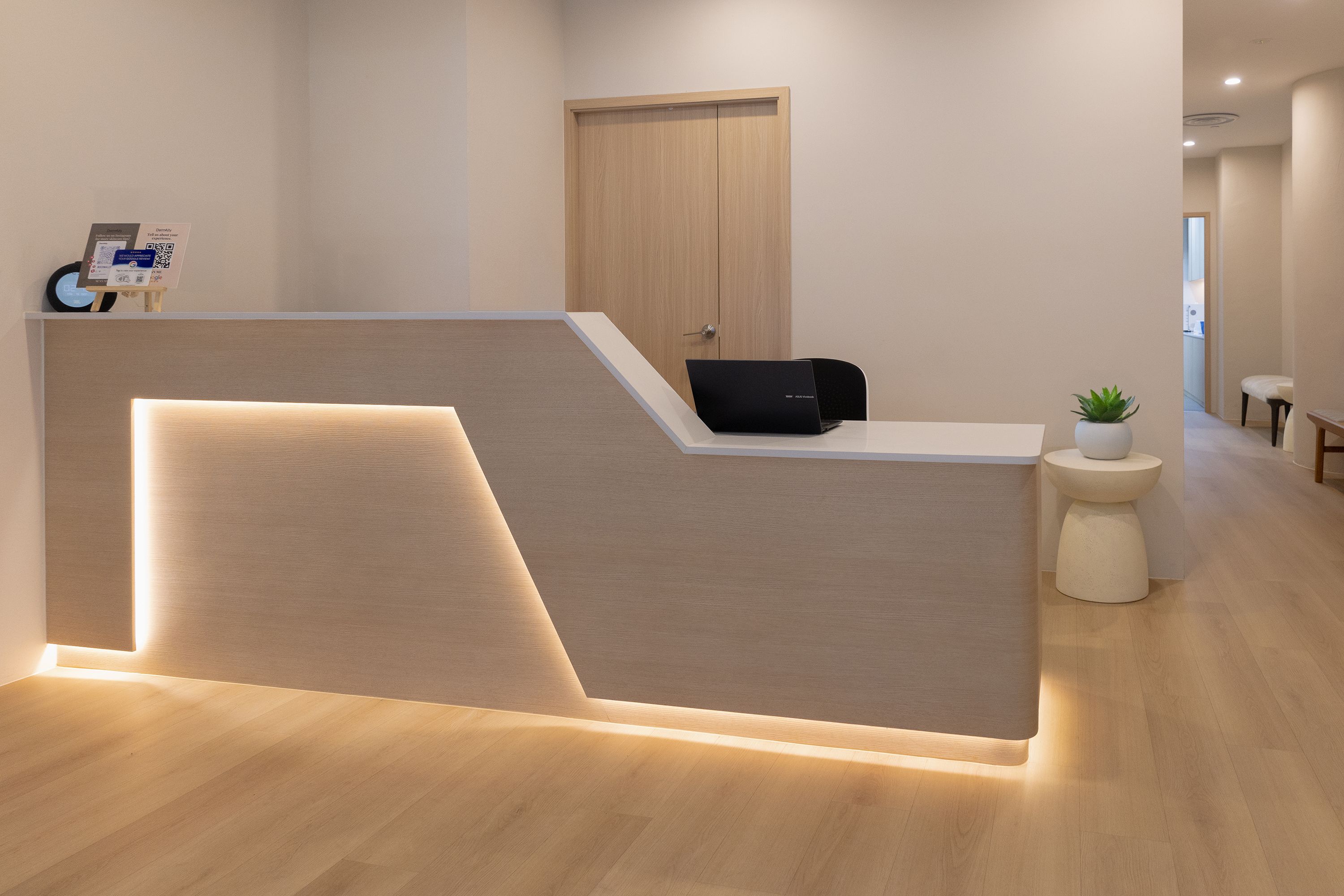 Reception counter at The Acne Clinic in i12 Katong Singapore with warm minimalist interior design.