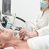 Healthcare professional performing a thyroid ultrasound, illustrating Cedar Endocrine Clinic’s well-equipped facilities and up-to-date treatment options for endocrine disorders in Singapore.