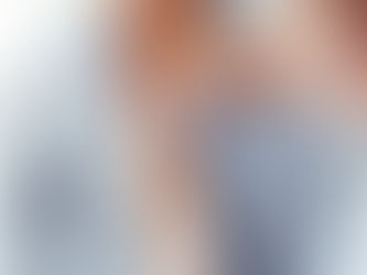 Doctor using a stethoscope on a patient's chest. Patient wears a blue striped shirt. Medical setting, bright lighting, focused care.