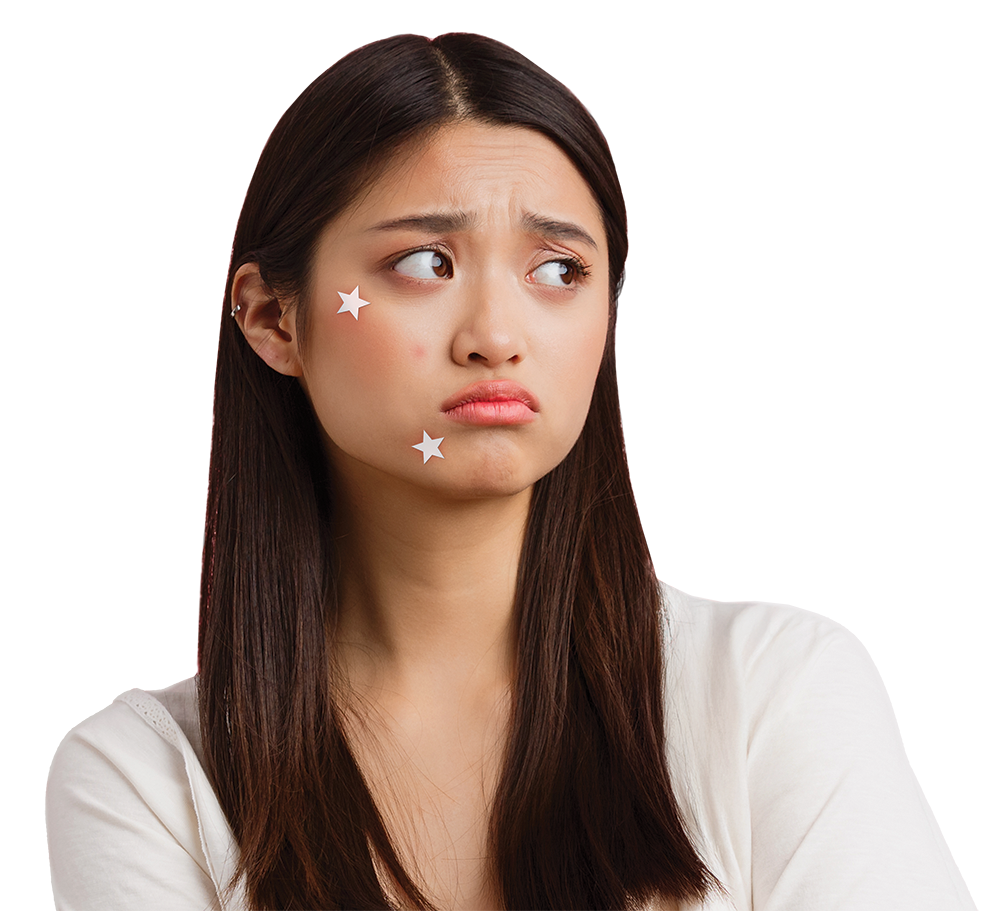 Young woman with acne patches on her face looking concerned at The Acne Clinic in i12 Katong Singapore.