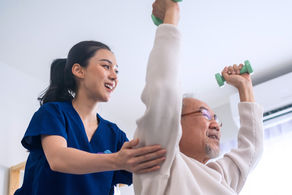 Geriatric nurse assessing muscle strength in a senior woman using a chair stand test in a clinic setting