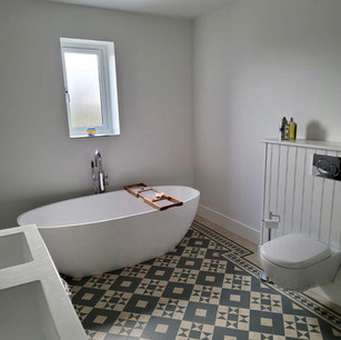 Bathroom tiles stand alone bath