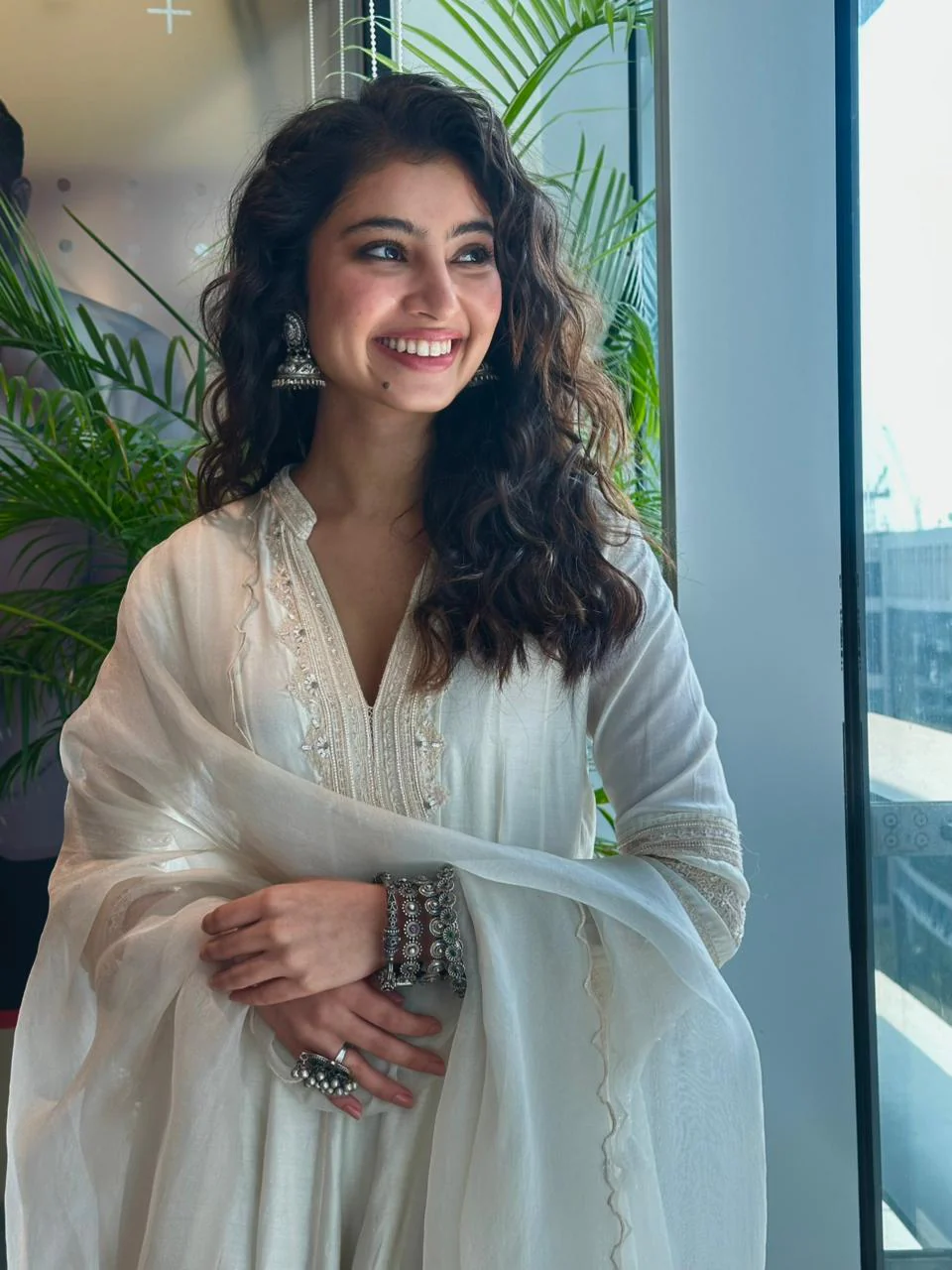 Sara Arjun in Shilpsutra off-white Anarkali set smiling close up silver jewellery