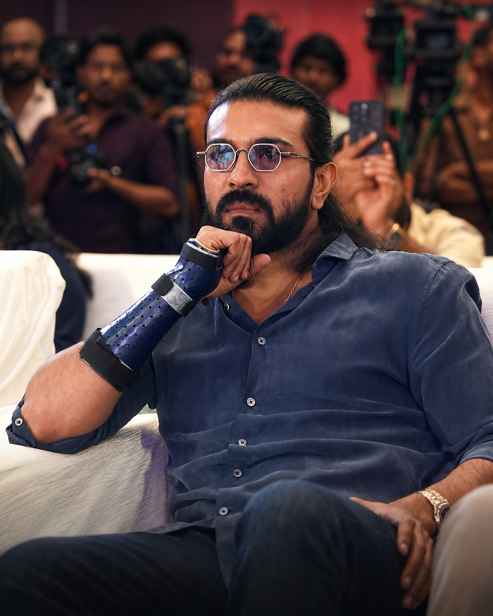 Ram Charan speaking on stage wearing Capote Eyewear C003 glasses