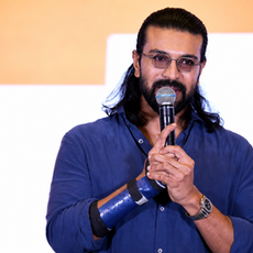 Ram Charan seated at Peddi Thank You Press Meet wearing Capote Eyewear C003