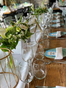 table with some flowes insdie a vase on