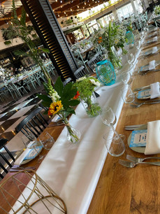 Vases on a table a sunflower.jpeg