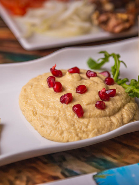 greek plates on a table, food photography, fava