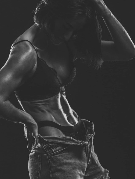 model posing in a gym wearing my protein brand