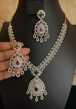 Beautiful czs necklace and Ear rings with Czs and Ruby and Emerald stone