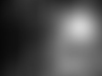 An astronaght and a android standing on a large asteroid backlit and embracing.