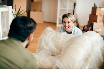 cheerful-woman-having-fun-with-her-husband-while-moving-into-new-apartment.jpeg