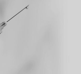 Hand holding syringe_edited_edited.jpg