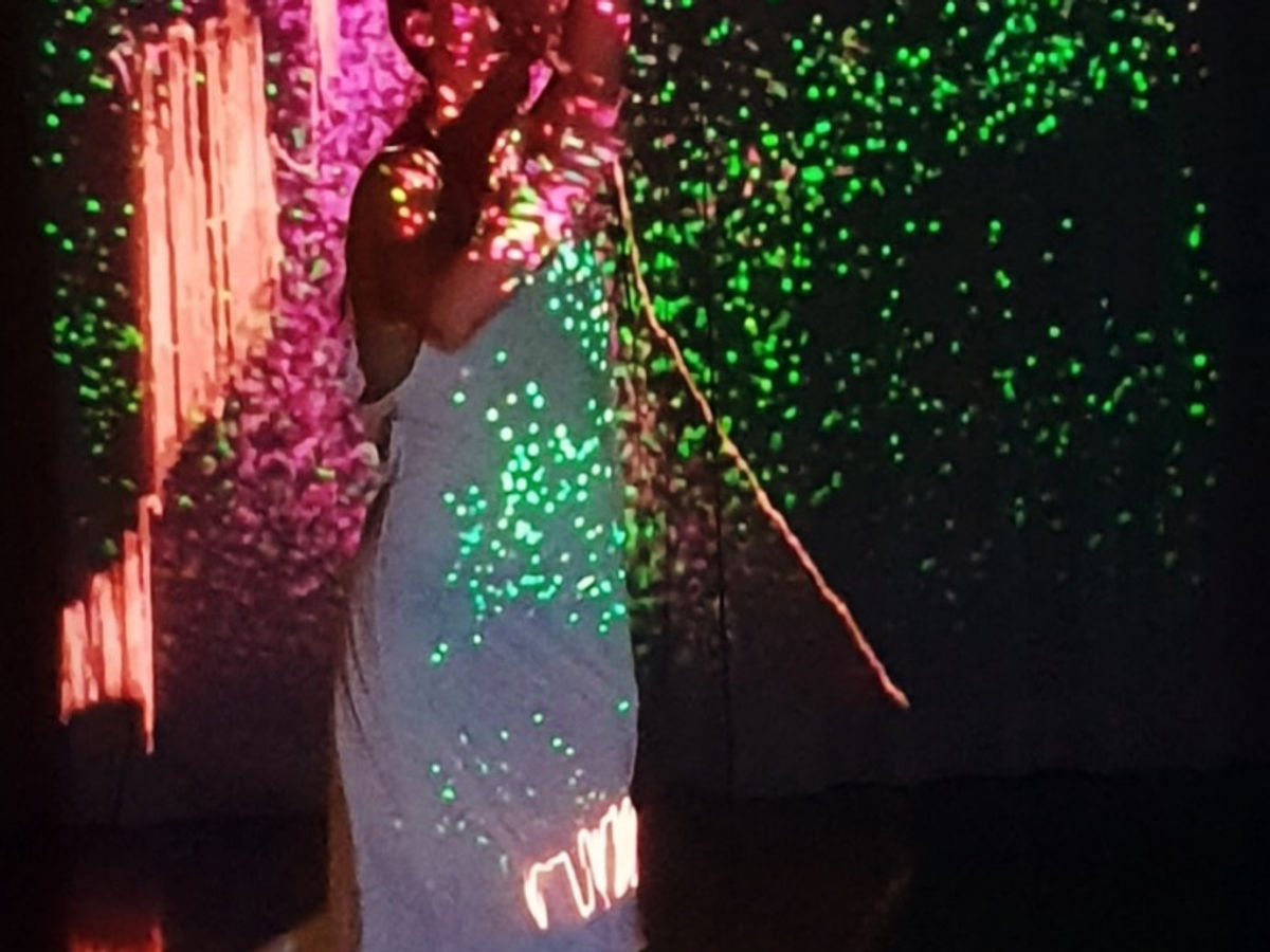 Live dance performance with projection and layered light
