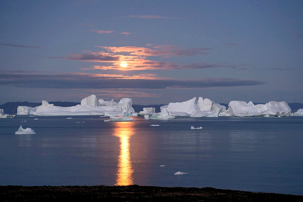Moonlight over icebergs near Saqqaq, Greenland