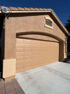 LGND Painting team repairing stucco and applying durable paint to a Tucson home for a smooth, modern finish.