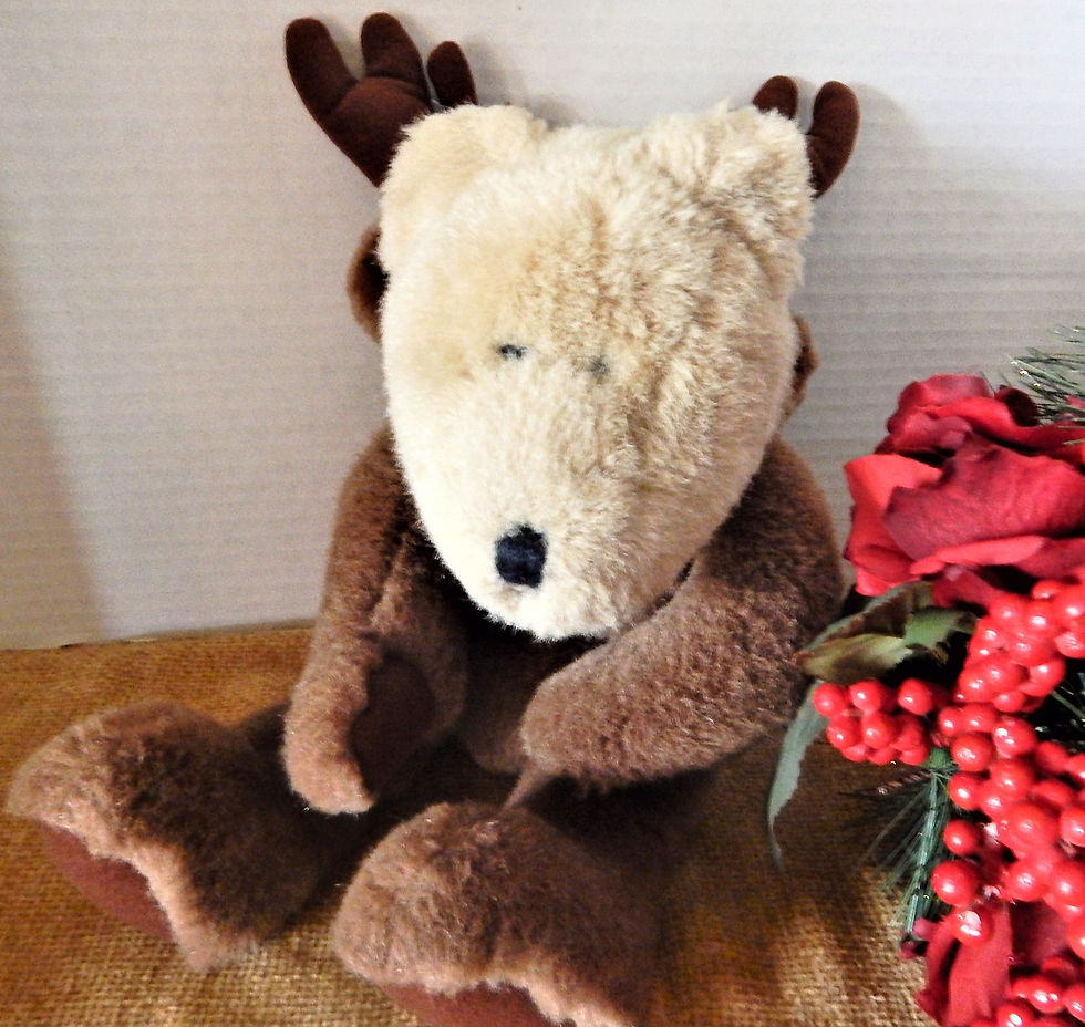 Thumbnail: Photograph of a teddy bear dressed as a reindeer, a vintage Christmas toy decoration from A Vintage Addiction