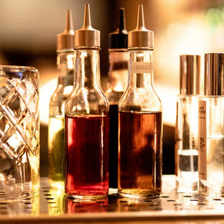 Photograph of cocktail bitter bottles on bar top