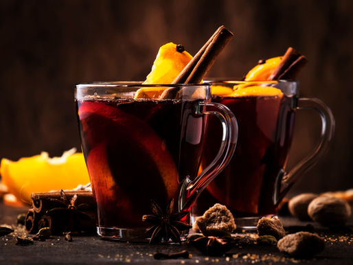 Two mulled wine drinks on a bar top