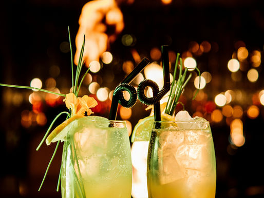 Two Caribbean cocktail on a bar topl