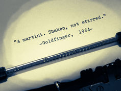 Typewriter with paper in it featuring James Bond movie "Goldfinger" script cover