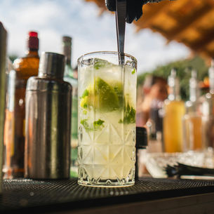 Bartender making a Caipirinha cocktail
