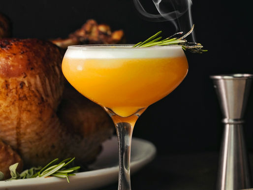 Photograph of a smoking cocktail next to a Thanksgiving turkey