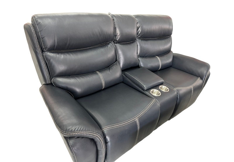 Deep navy power reclining sofa on display at MATCO Mattress & Furniture in Pensacola, Fl