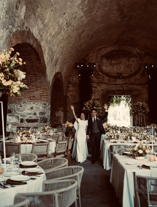 Private villa microwedding in Rome with luxury floral installation, candlelit dinner tables, and fireworks display over umbrella pine trees at sunset