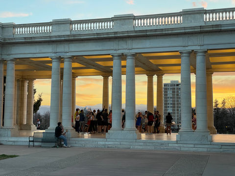 Stunning sunset illuminating the backdrop of the Cheesman Park Pavilion, enhancing the ambiance of the Silent Disco event by Silence at the Disco