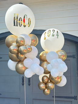 White and gold themed homecoming balloon arch
