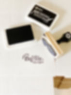 Custom stamp with the Sincerely Barbie logo pressed on a row of packaging boxes, featuring the Zazzle logo and an open ink pad beside it showing a cozy handmade branding detail for small business packaging inspiration.