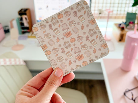 Hand holding a pastel sublimation coaster with a cozy pattern, made using a beginner sublimation setup with an Epson EcoTank printer.