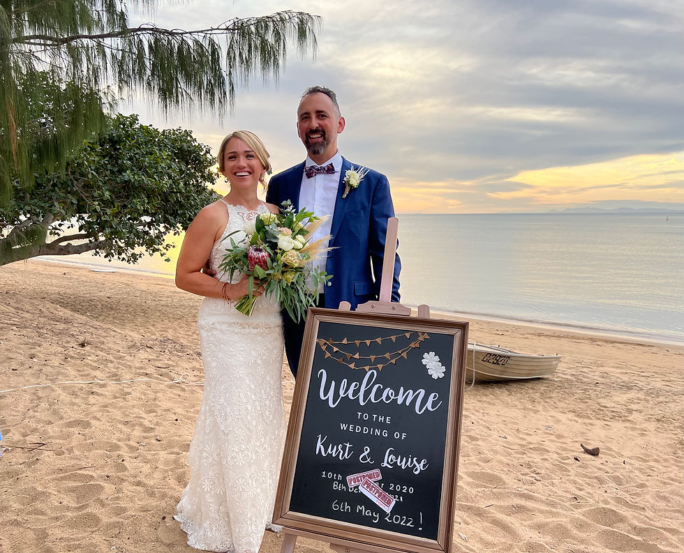 Eye-level view of a tropical beach with clear blue water and white sand