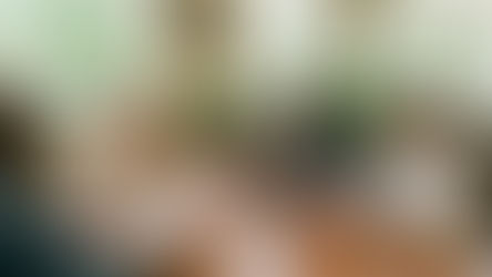 Senior in Gainesville, Georgia comparing Medicare and private insurance documents side by side at a desk.