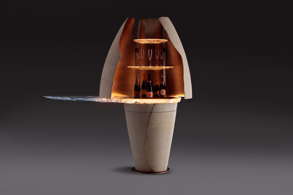 Furniture photography by Simon Eldon, shot in a sussex studio, a bespoke drinks cabinet by furniture designer Marc fish. the cabinet is cocoon shaped with a glass shelf 
